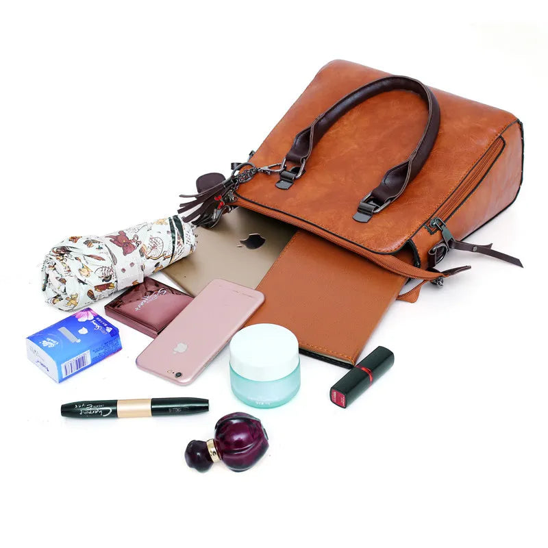 Kit Premium em Couro Genuino - Bolsa + Carteira + Carteira de Mão + Necessaire de Brinde